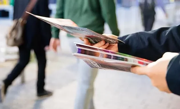 Distributing flyers on the street